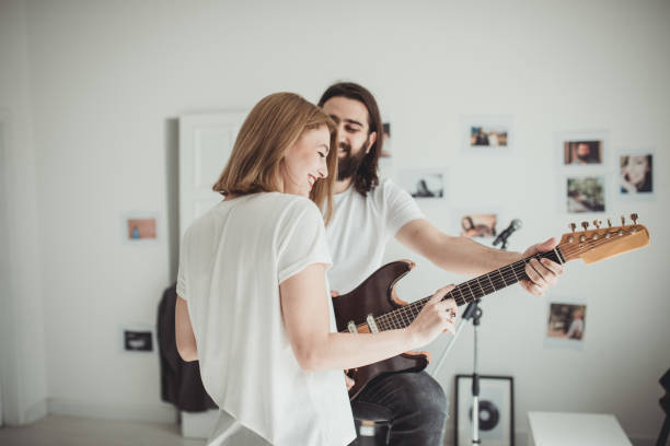 istock Couple having fun with music 855640616