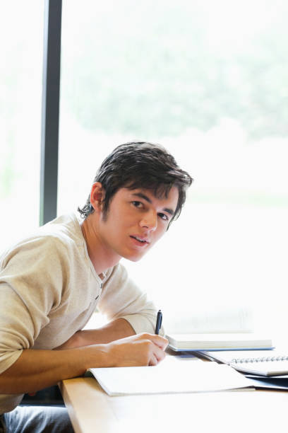 istock Portrait of a young student working on an essay 855651014