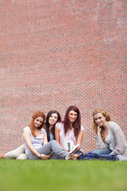 istock Portrait of friends posing with a book 855672112