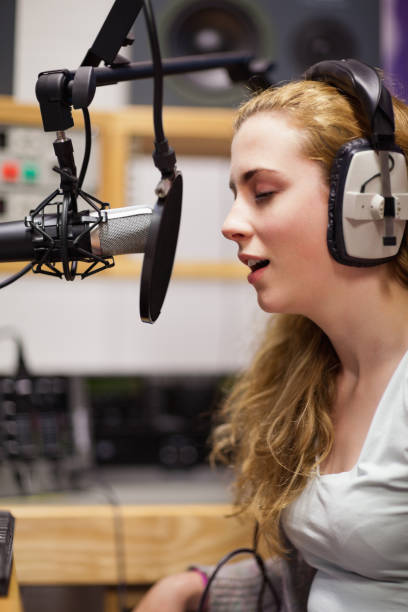 istock Portrait of a singer recording a track 855677894