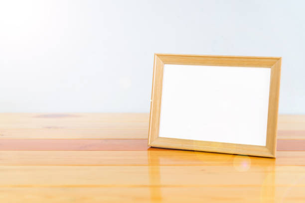 istock Empty wood photo frame on wooden table with copy space, picture memory. 855697862