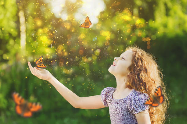 istock Laughing cute child with a butterfly on his hands. 855706272