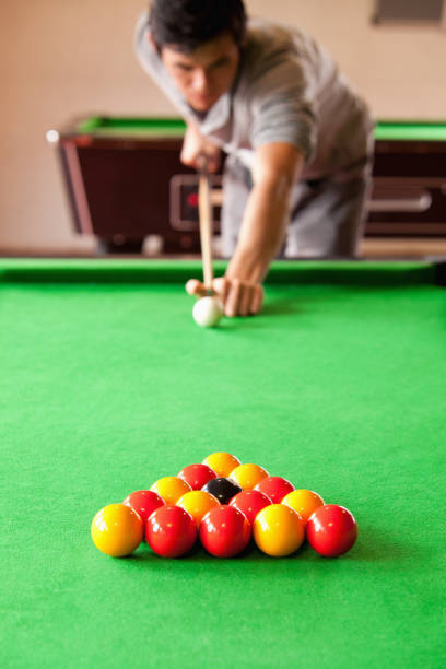 istock Portrait of a man playing snooker 855714420