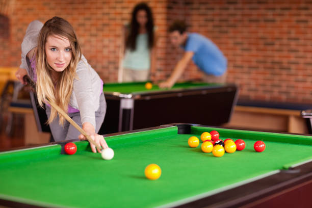 istock Student woman playing snooker 855717196
