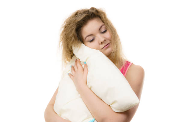 istock Sleepy woman hugging white pillow 855725656