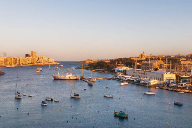 istock Valletta seafront skyline view across Marsamxett from Sliema, Malta. Panorama sunset view of Marsamxett harbour. 855745328