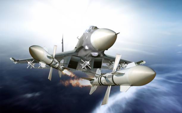 istock Fighter plane firing missile 855745664