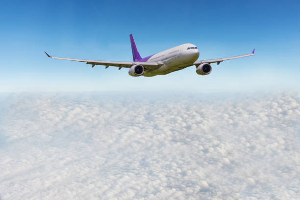 istock flight through clouds sunrise clouds Blue nature Backrounds.Transportation and travel concept 855746100