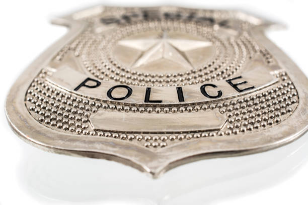 istock Police badge macro photo on white background 855749034