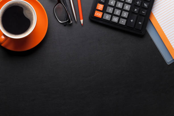 Office desk with coffee and supplies