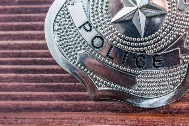 istock Police badge close-up on a table 855752418