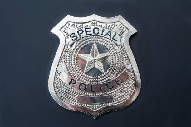 Police badge front view on a blackboard stock photo