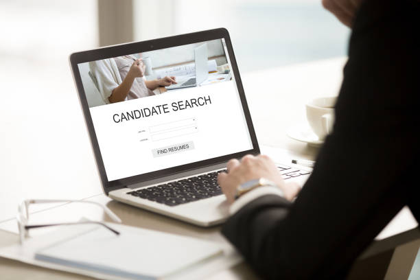 istock Businessman using online resume search, choosing cv, human resou 855753020