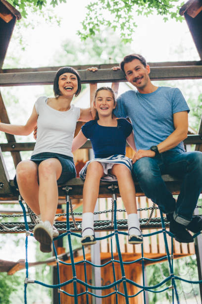 istock Family playing in park 855755676