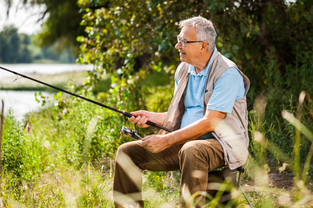 istock Senior man fishing 855758488