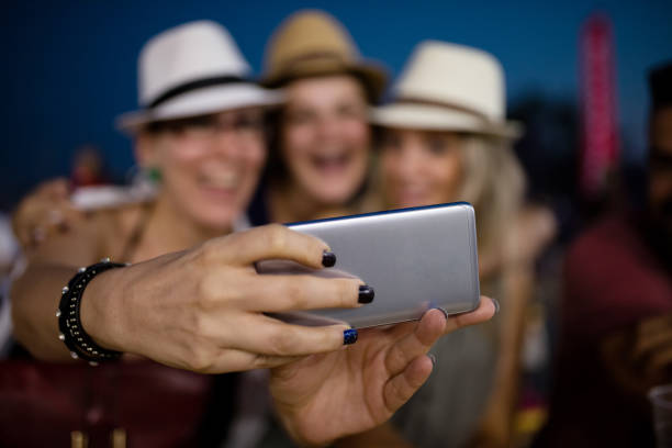 istock Making selfie at summer festival 855759946