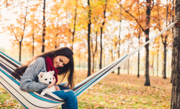 istock Woman and dog in hammock 855760532