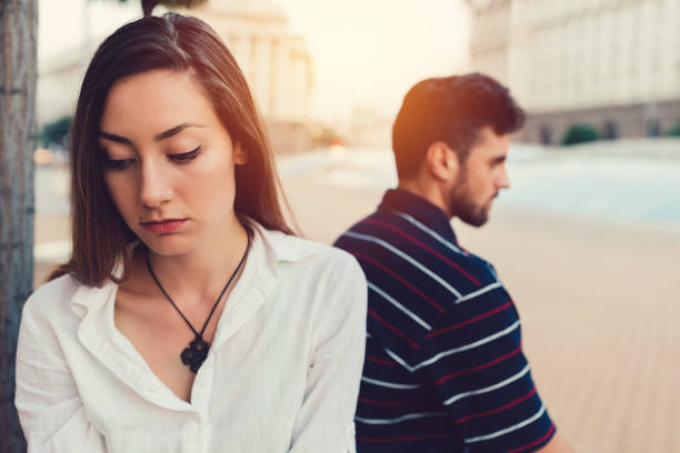 Young woman ignoring her boyfriend