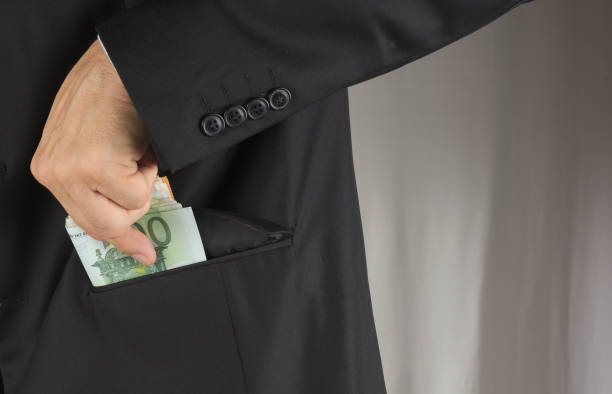 istock Pencil pusher asking for a bribe in euros or in dollars 855771370
