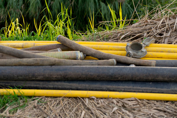 istock mixes drain pipes in landscape, for dewatering 855778700