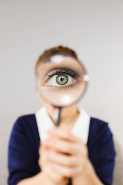 istock Funny woman office working secretary with magnifier 855778932