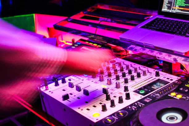 istock DJs are turntablism turntables plate mixer night party pub Motion blur abstract background. 855782990