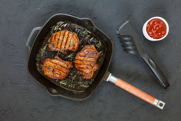 istock Steaks barbecue grilled in a frying pan 855783268
