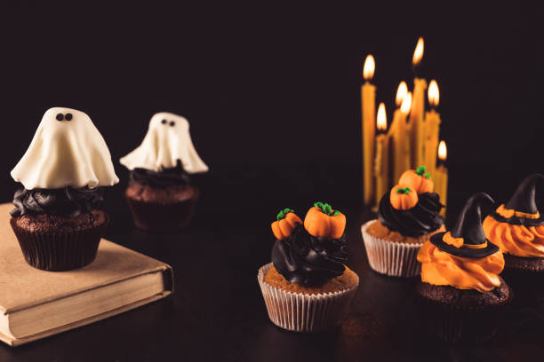 istock halloween cupcakes and burning candles 855799178