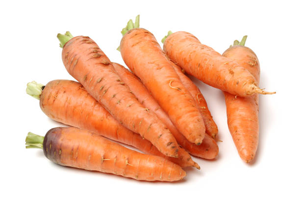 istock Heap of carrots isolated on a white background 855799548