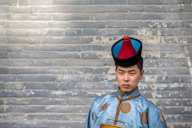 istock mongolian man in traditional outfit 855809328