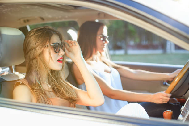 istock young women in the car smiling 855816474