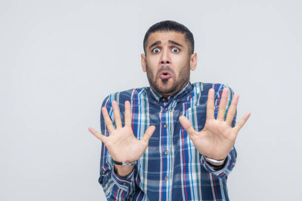 istock Shocked businessman posing on gray background. Isolated, studio shot 855820348