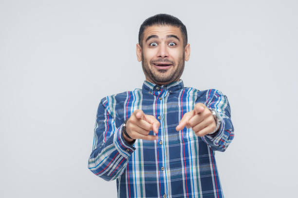 istock I need this! Happiness man pointing fingers at camera and have a joyful look. 855820414