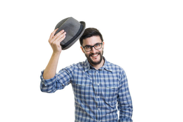 Attractive bearded man hold his hat as greeting sign