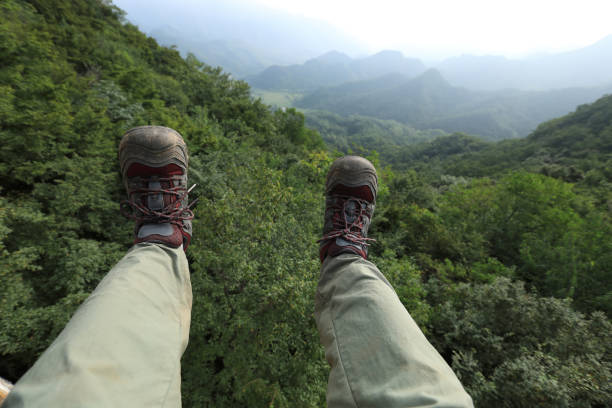 istock hiker legs on the top of mountain 855826274
