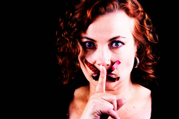 Woman with her mouth taped shut