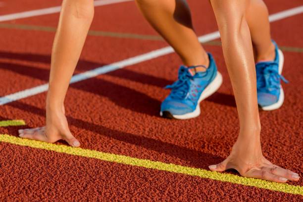 istock Close-up of woman's legs on start before jogging 855829998