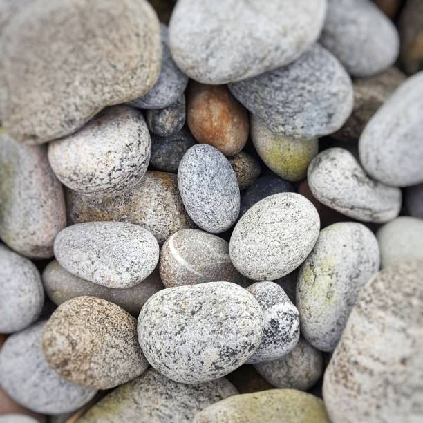istock Close-up of rounded pebbles on a beach 855844444