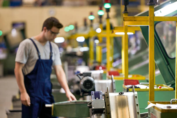 Senior worker in bolt factory.