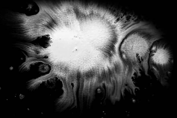 istock abstract paint brush stroke shape white ink splattering flowing and washing on black background, ink splatter splash illustration 855847286