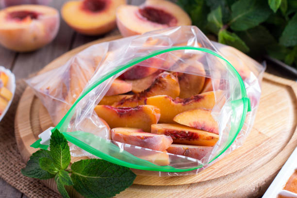 istock Frozen slices of peaches in the bag 855847434