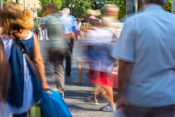 istock Blurry people walking in the street 855848074