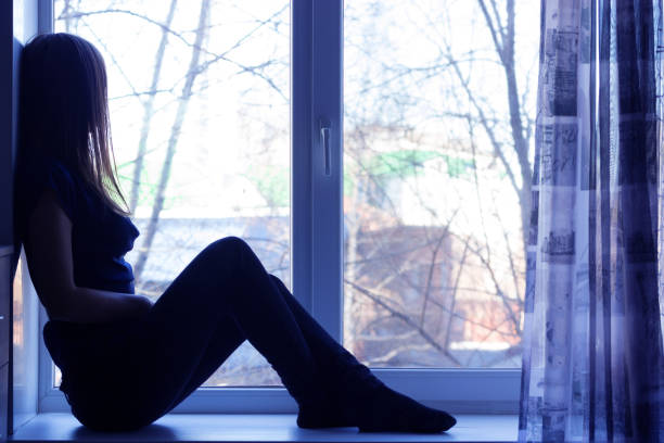 istock sad beautiful girl at home tonight 855848754