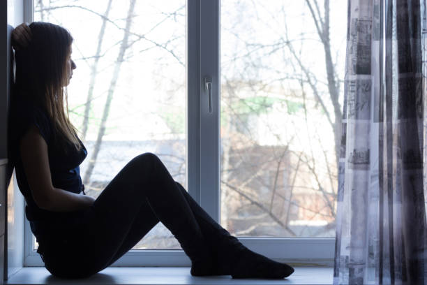 istock sad beautiful girl at home tonight 855848758
