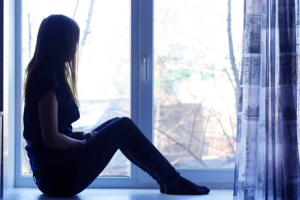 istock sad beautiful girl at home tonight 855848762