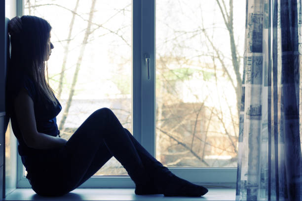 istock sad beautiful girl at home tonight 855848774