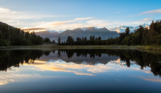 Dawn Breaks Over Lake Matheson In New Zealand