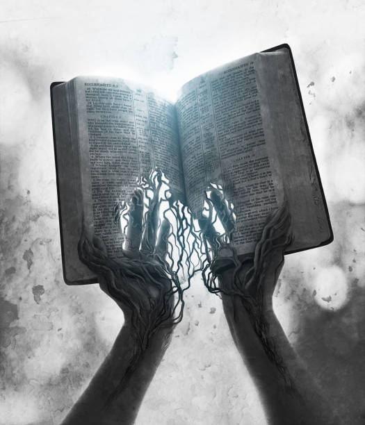 istock Bible pages rooted to hands 855860532