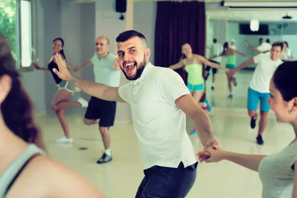 Photo of Man is dancing rock-n-roll with partner