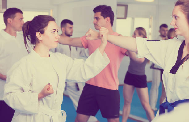 istock Adult trainees show their skills in training on karate 855867216